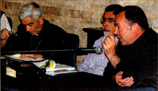 [Mons. Michele Pennisi, Claudio Gentili e Mons. Adriano Vincenzi al tavolo dei relatori]